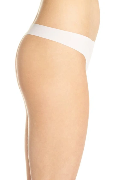 Shop Calvin Klein Invisibles Thong In Nymphs Thigh