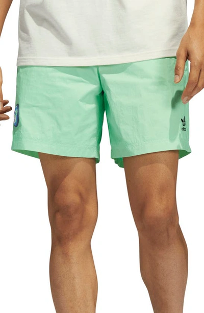 Shop Adidas Originals Happy Earth Recycled Nylon Shorts In Beam Green