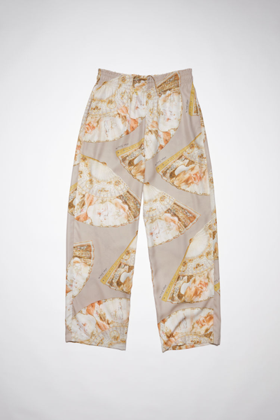 Shop Acne Studios Fan Print Trousers In Brown