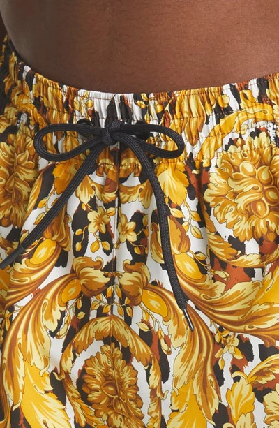 Shop Versace Wild Baroque Print Swim Trunks In Gold/ Black