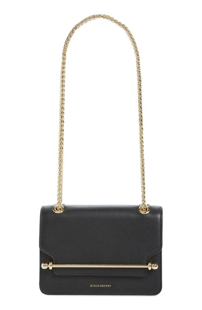 Shop Strathberry Mini East/west Leather Crossbody Bag In Black