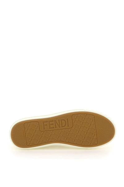 Shop Fendi Domino Sneakers In White