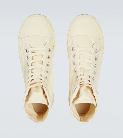 Shop Balenciaga Paris Distressed Canvas Sneakers In White/white