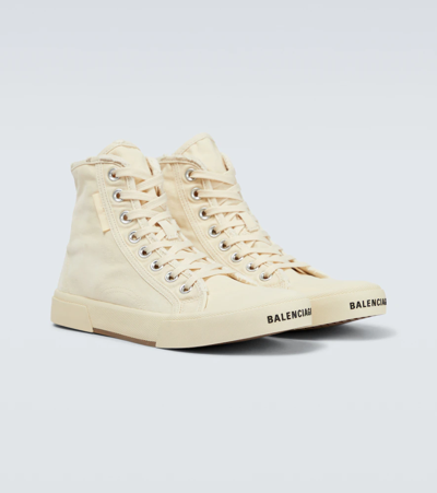 Shop Balenciaga Paris Distressed Canvas Sneakers In White/white