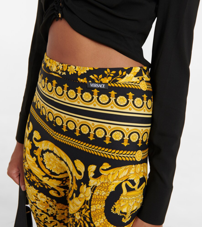 Versace Gold And Black Stretch Fabric Leggings With Baroque Heriatge Print In Black+gold