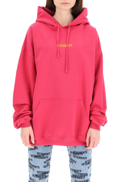 Shop Vetements Logo Label Hoodie In Fuchsia