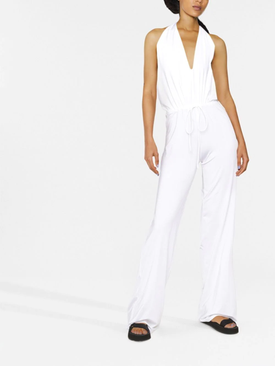 Shop Fisico Halterneck Flared Jumpsuit In White