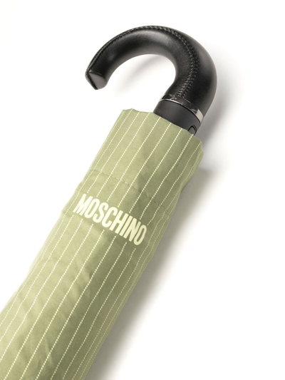 Shop Moschino Logo-print Pinstripe Umbrella In Grün