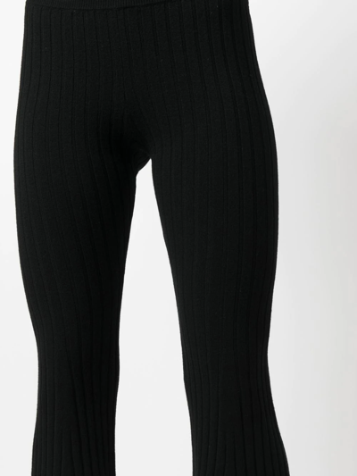 Shop Versace Ribbed-knit Flared Trousers In Black