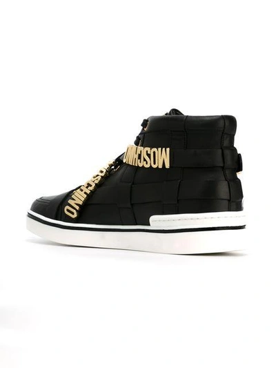 Shop Moschino - Buckle Embellished Sneakers