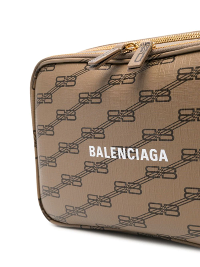 Shop Balenciaga Bb-print Leather Clutch Bag In 褐色
