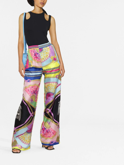 Shop Versace Graphic-print Wide-leg Trousers In 粉色