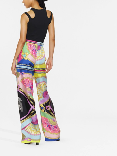 Shop Versace Graphic-print Wide-leg Trousers In 粉色