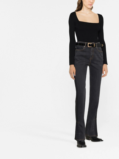 Shop Alexander Mcqueen Logo-patch Bootcut Jeans In Black