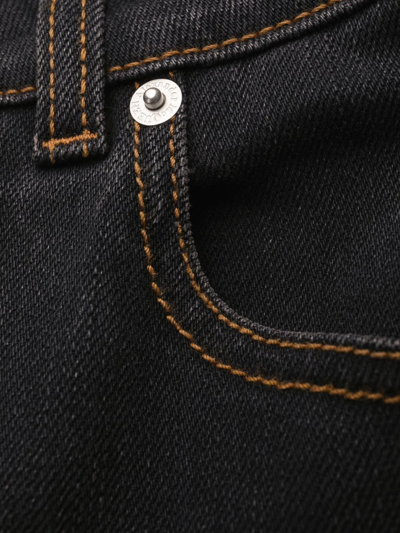 Alexander Mcqueen Logo-patch Bootcut Jeans In Black