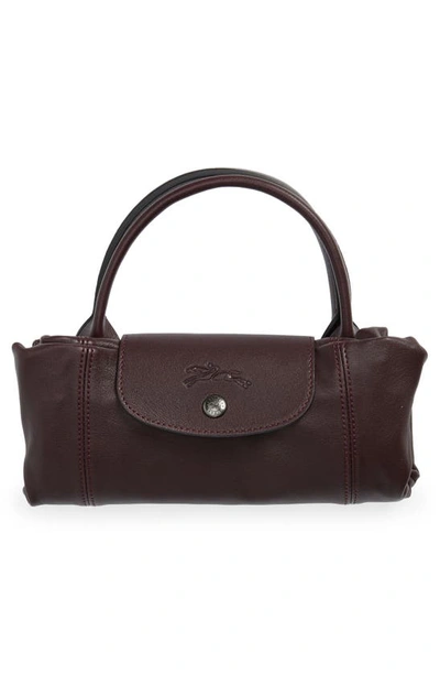 Shop Longchamp Small Le Pliage Cuir Leather Top Handle Bag In Burgundy