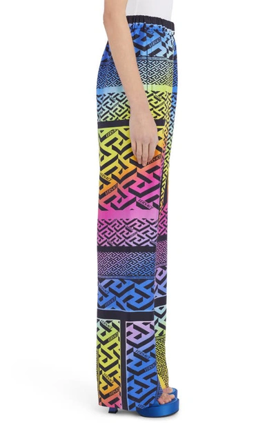 Shop Versace La Greca Rainbow Print Monogram Silk Pants In Multicolor