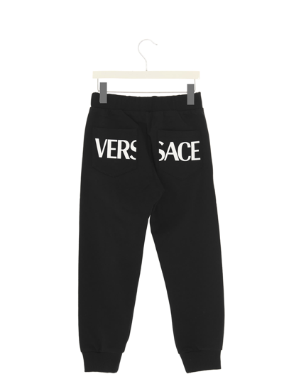 Shop Versace Greca Joggers In Black
