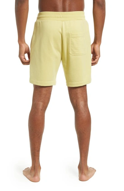 Shop Alo Yoga Chill Shorts In Dusty Yellow