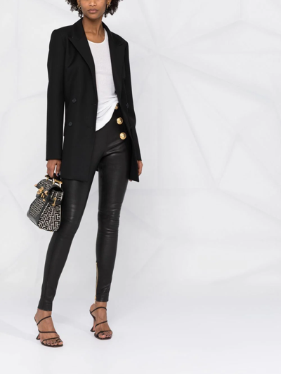 Shop Balmain Button-embossed Leather Leggings In Black