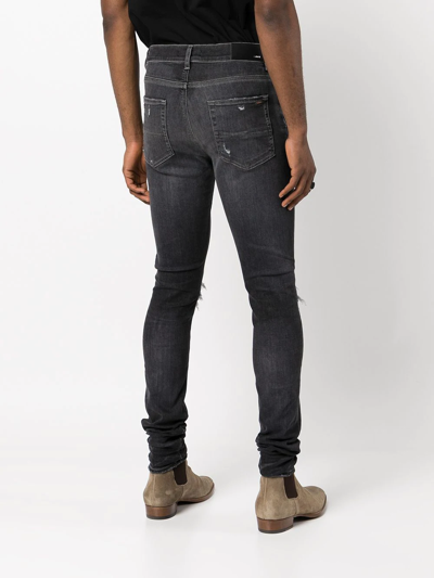 Shop Amiri Distressed-finish Skinny Jeans In Black