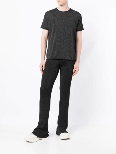 Shop Dion Lee Marl-knit Ribbed Flared Trousers In Black
