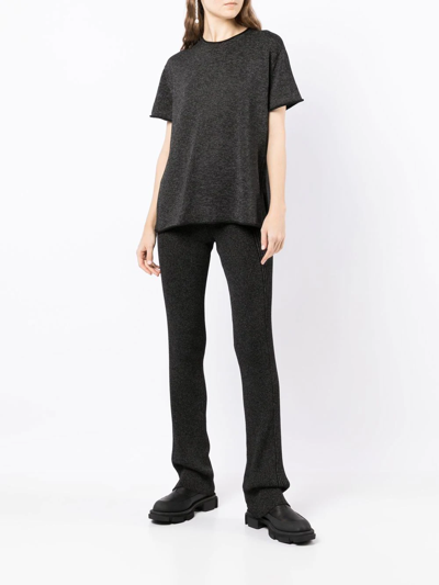 Shop Dion Lee Marl-knit Ribbed Flared Trousers In Black