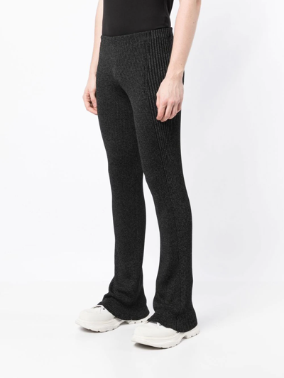 Shop Dion Lee Marl-knit Ribbed Flared Trousers In Black