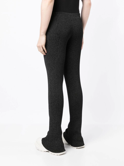 Shop Dion Lee Marl-knit Ribbed Flared Trousers In Black