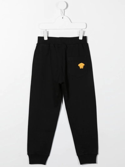 Shop Versace Medusa Embroidery Track Pants In Black