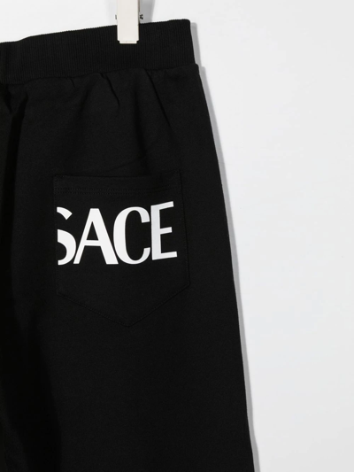 Shop Versace Teen Greca Print Track Pants In Black