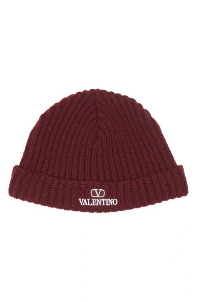 Shop Valentino Vlogo Ribbed Virgin Wool Beanie In Bordeaux