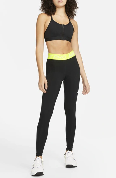 Shop Nike Pro Mid Rise Leggings In Black/ Volt/ White