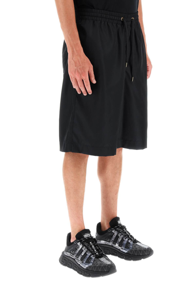 Shop Versace La Greca Nylon Bermuda Shorts In Black