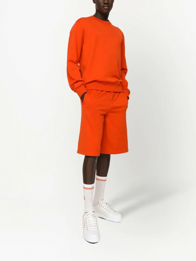 Shop Dolce & Gabbana Embossed-logo Jersey Track Shorts In Orange