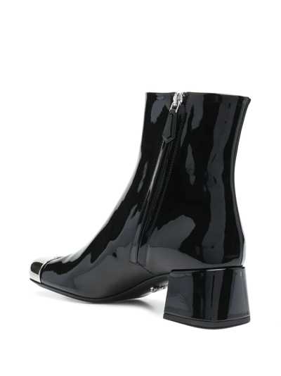 Prada Triangle Logo Plaque Boots In Schwarz