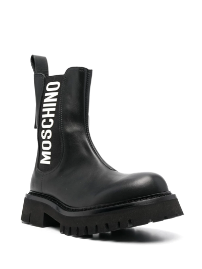 Shop Moschino Logo-print Leather Ankle Boots In Black