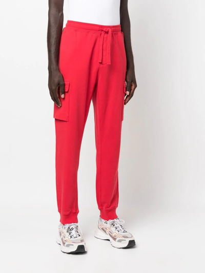 Shop Stone Island Tapered-leg Track Pants In Red