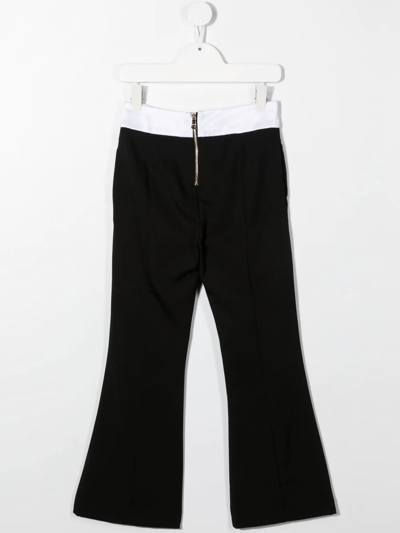 Shop Balmain Button-detail Zipped Flared Trousers In Black
