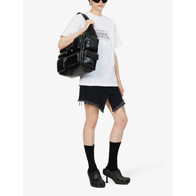 Shop Balenciaga Distressed Brand-patch Denim Mini Skirt In Rubber Black