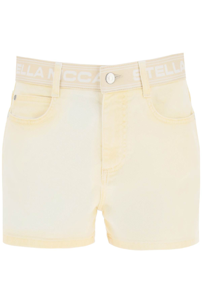 Shop Stella Mccartney Denim Shorts With Branded Band In Sand Yellow (yellow)