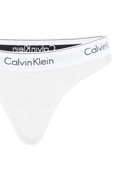 Shop Calvin Klein Branded Border Thongs In White (white)