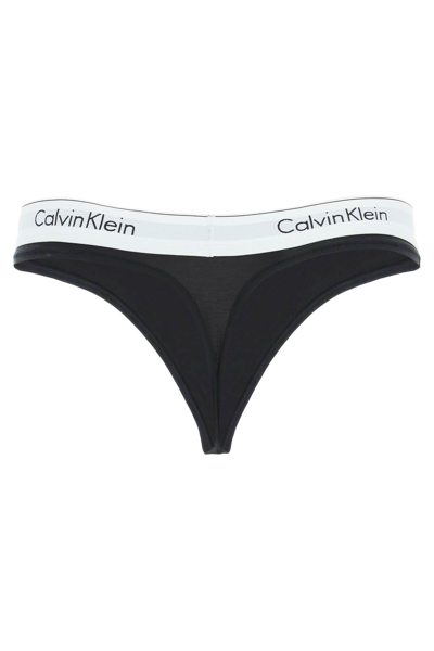 Shop Calvin Klein Branded Border Thongs In Black (black)