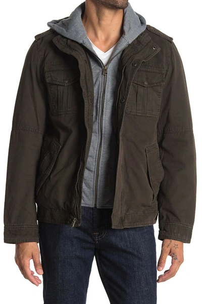 Shop Levi's® Washed Cotton Faux Shearling Lined Hooded Military Jacket In Worker Brown