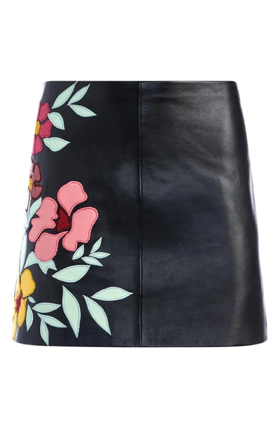Shop Alice And Olivia Riley Floral Detail Faux Leather Skirt In Black/ Multi