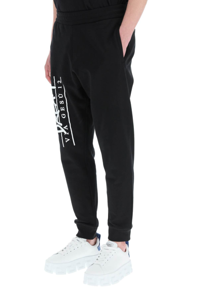 Shop Versace Dream Logo Print Sweatpants In Nero (black)