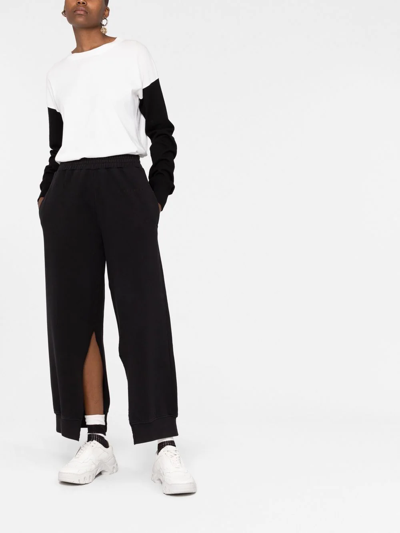 Mm6 Maison Margiela Split-cuff Cotton Track Pants In Black