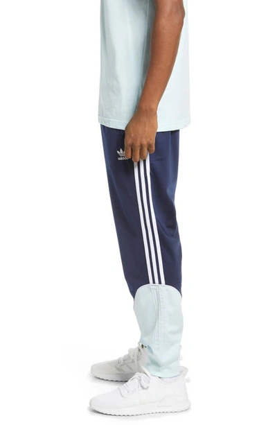 Shop Adidas Originals Sst Tricot Track Pants In Navy/ Blue/ White