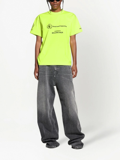 Shop Balenciaga Graphic-print Cotton T-shirt In Yellow