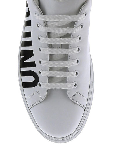 Shop Moschino Leather Low Sneakers In White
